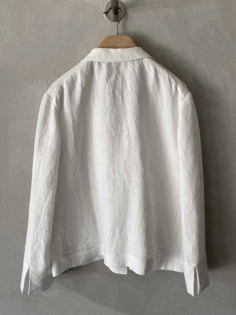 Marina Lari unlined oversized white linen jacket with notch lapels and one-button closure