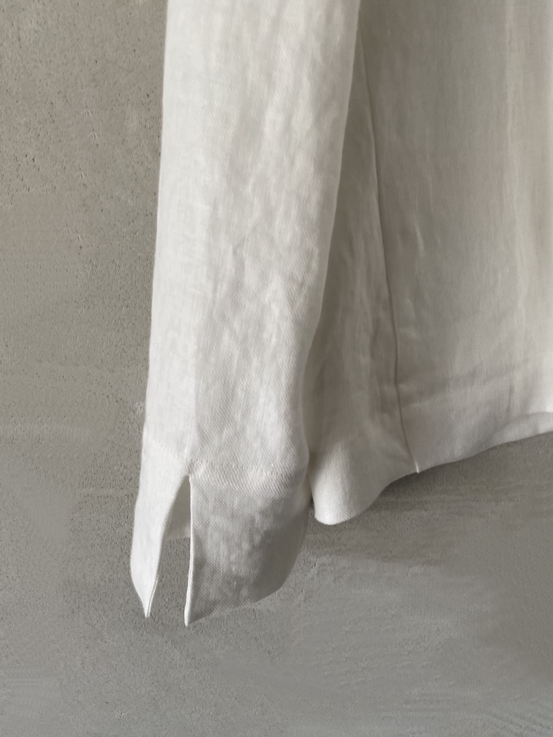 Marina Lari unlined oversized white linen jacket with notch lapels and one-button closure