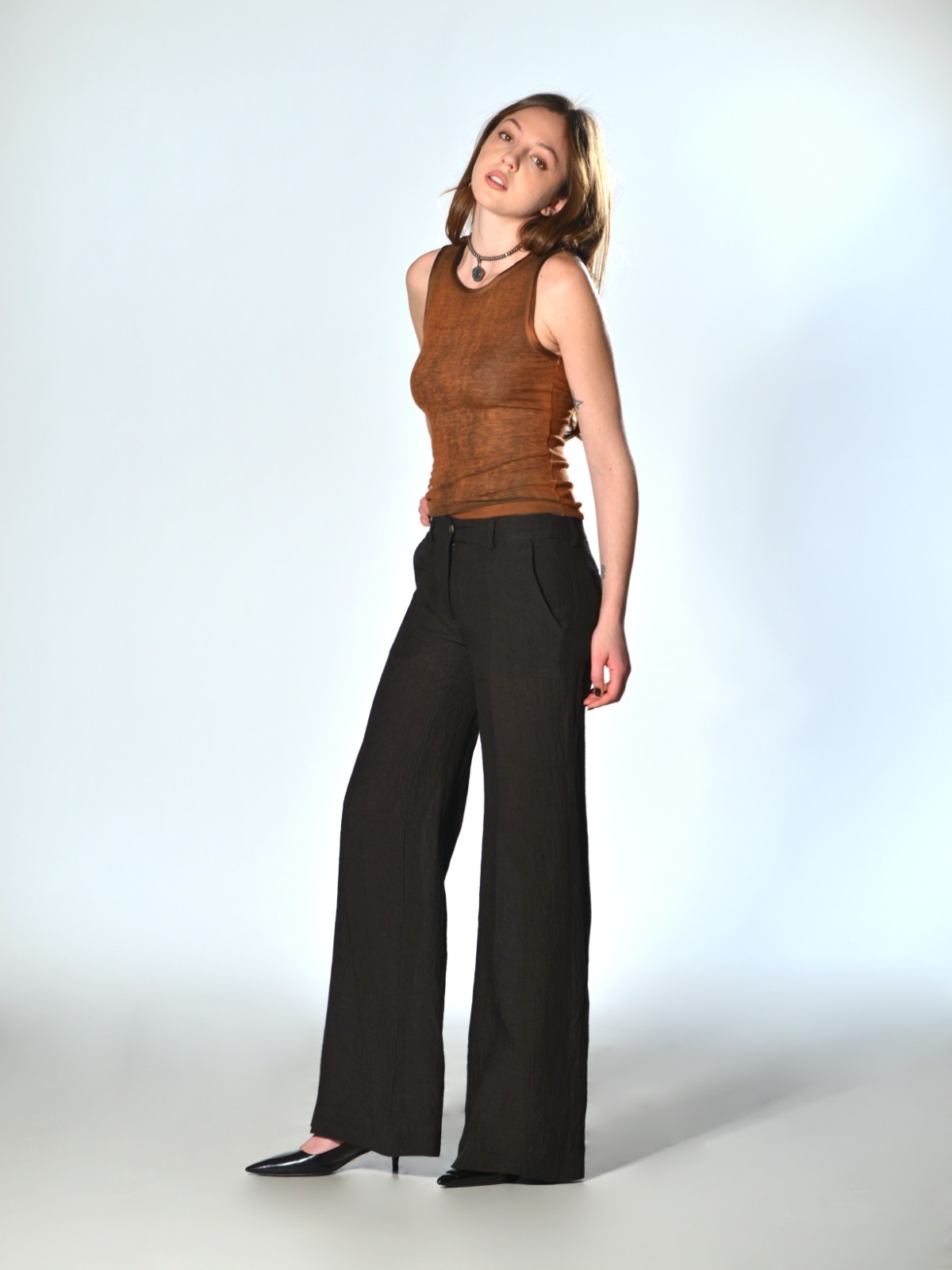 Brown straight-leg trousers with a slightly flared fit by Marina Lari