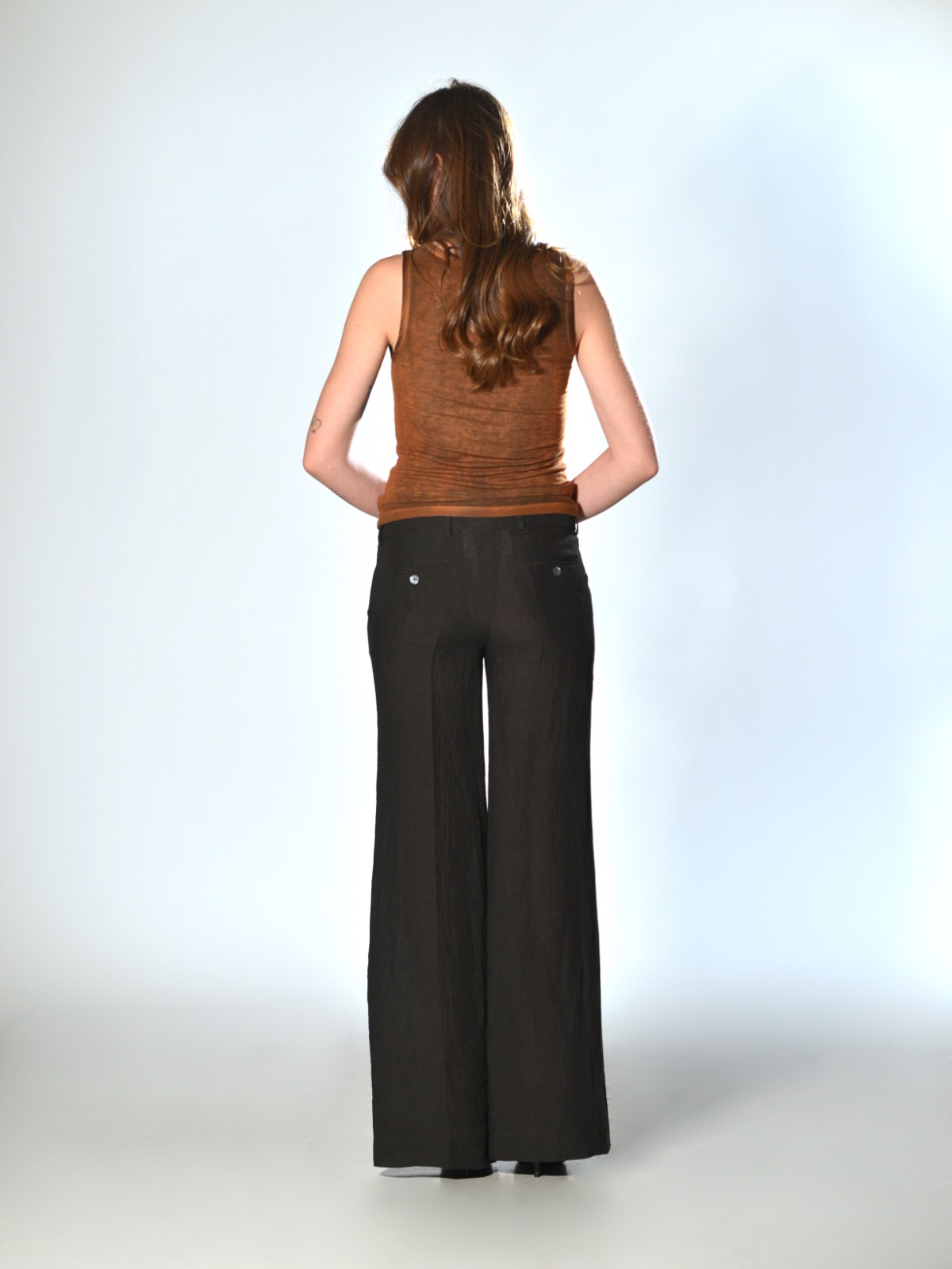 Brown straight-leg trousers with a slightly flared fit by Marina Lari