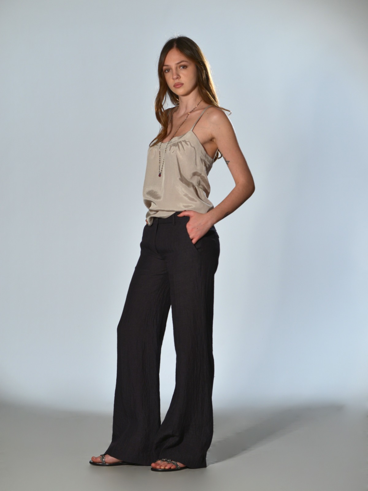 Marina Lari plum trousers with a slightly flared straight leg