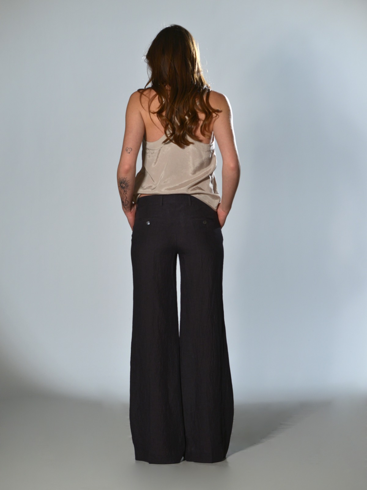 Marina Lari plum trousers with a slightly flared straight leg