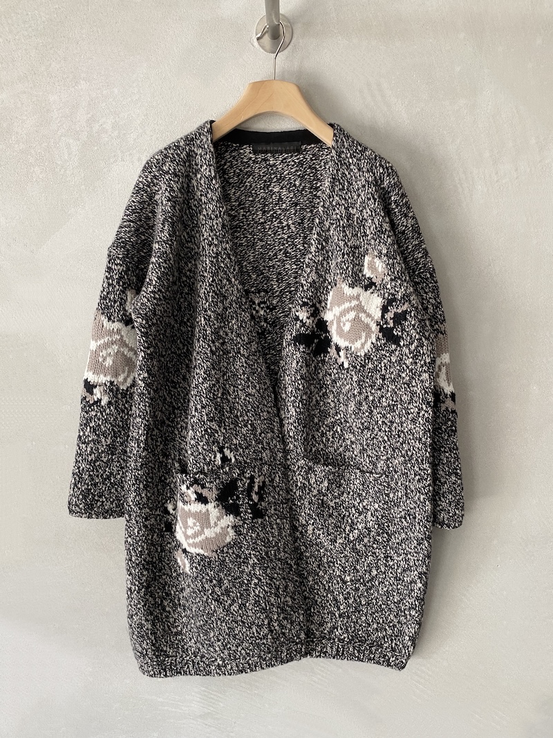 Marina Lari long black merino wool cardigan with floral inlays Long black cardigan in chiné merino wool, with contrasting floral inlays, patch pockets and oversized fit, Marina Lari.