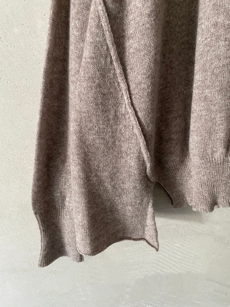 Marina Lari's beige oversized sweater in lightweight cashmere with visible stitching